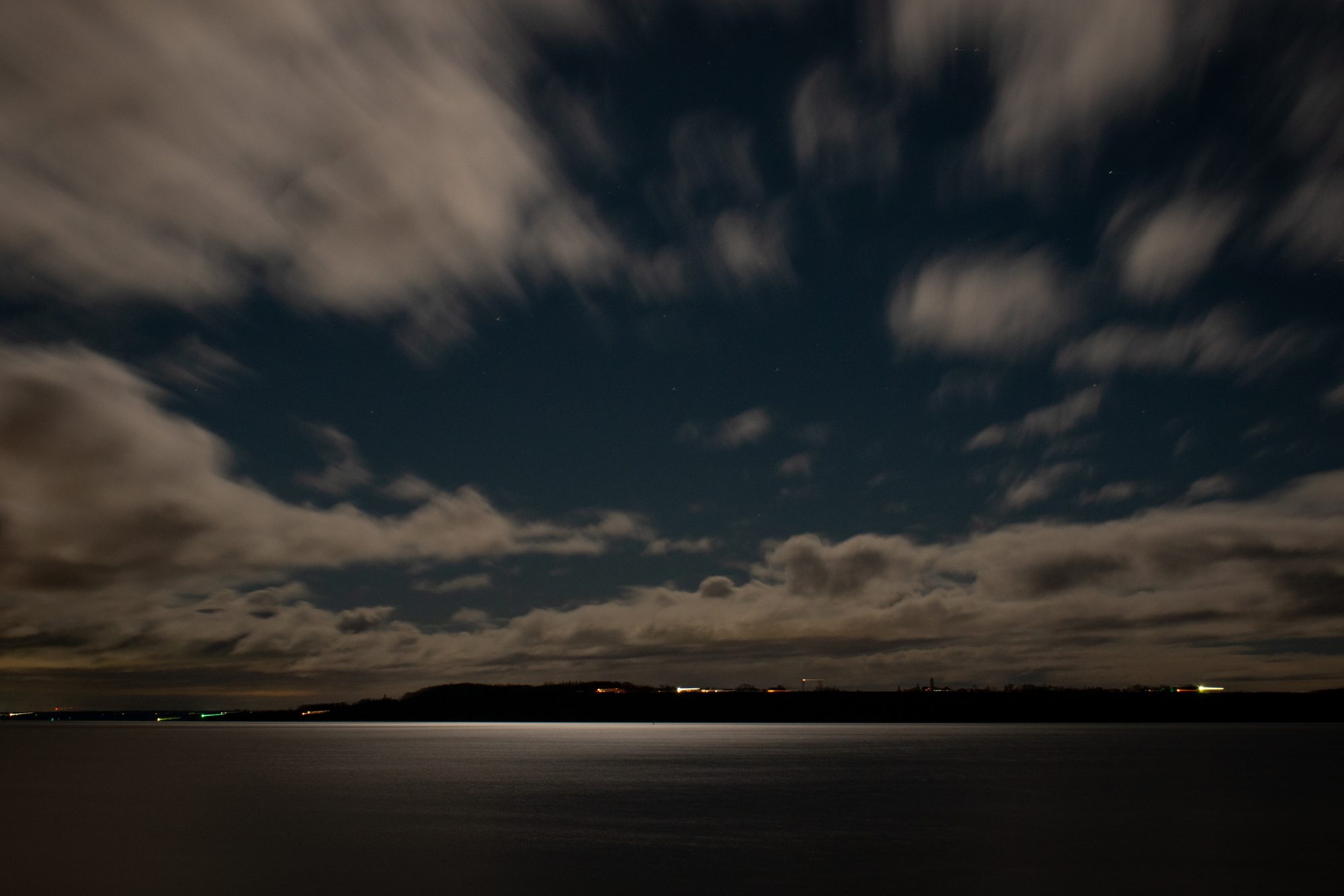 Clouds Over the Water at Night